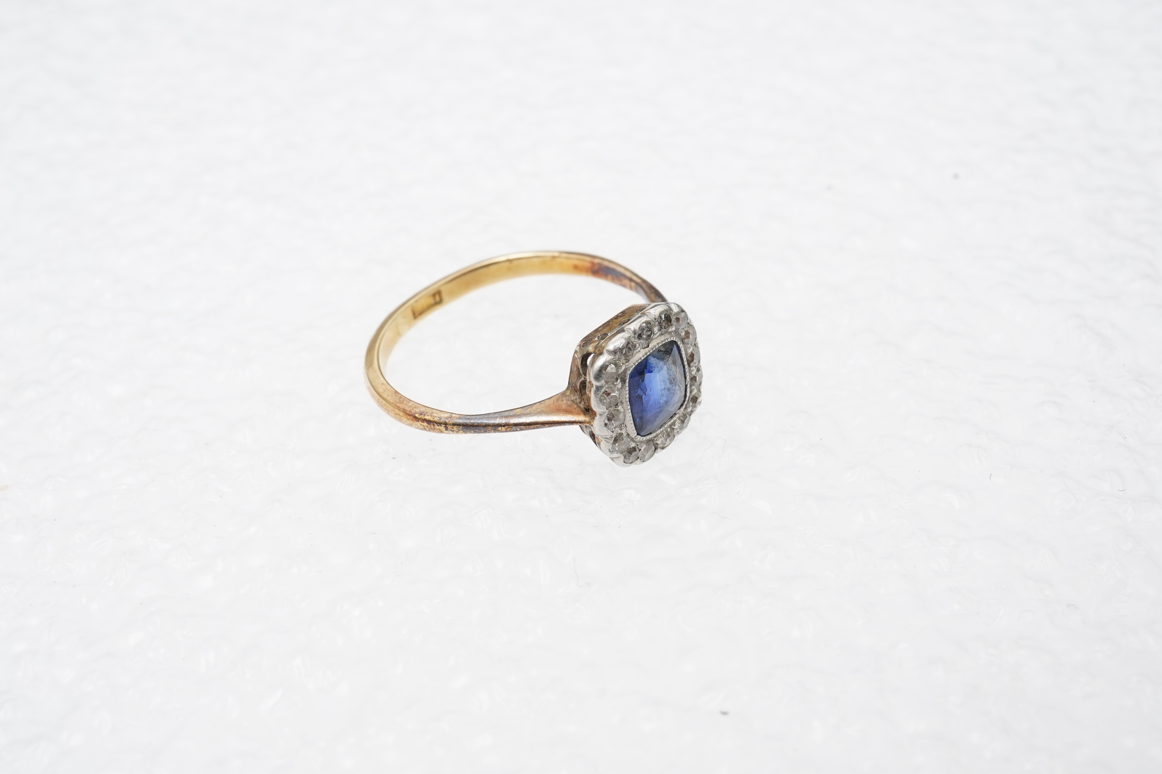 A sapphire and diamond cluster ring, early 20th century
